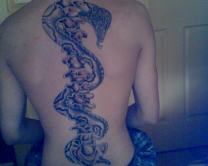 Snake And Back Bone Tattoo On Back